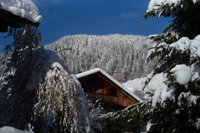 Snow-covered chalet in winter at the Beaumier hotel L'Alpaga in Megève