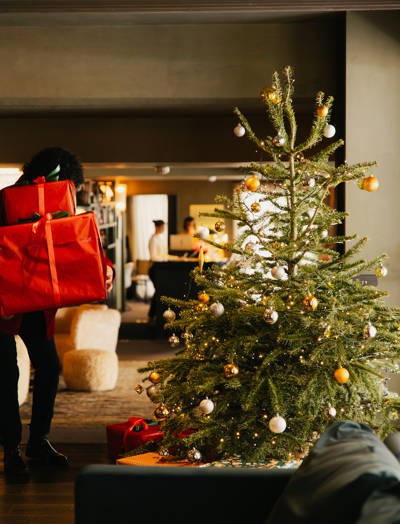 Christmas tree and gifts in the lobby of the Beaumier hotel Le Fitz Roy, Val Thorens