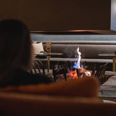 Fireside moments in Val Thorens in a mountain hotel, warm après-ski atmosphere