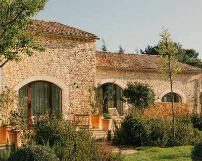 Provençal stone facade and gardens at the Beaumier hotel Capelongue in Bonnieux