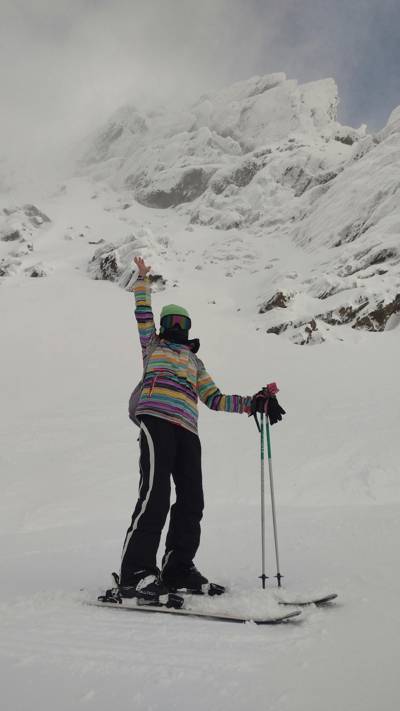 Skier celebrating on the slopes of Val Thorens, Beaumier ski resort