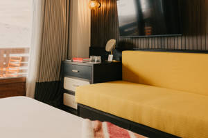 Espace de couchage supplémentaire avec canapé-lit à Val Thorens.