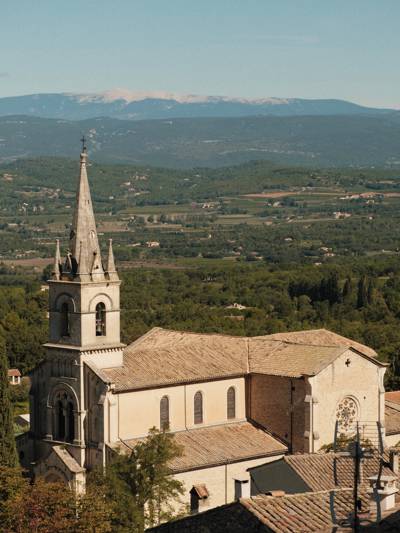 Church and Luberon valley view from the perched village of Bonnieux, near the Beaumier hotel Capelongue